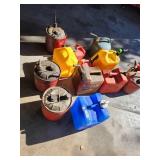 Collection of Assorted Metal and Plastic Fuel Cans and Containers