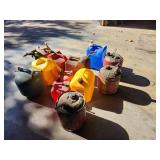 Collection of Assorted Metal and Plastic Fuel Cans and Containers