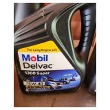 Automotive Fluids Lot: CAT DEO-ULS 10W-30 Oil, Mobil Delvac 1300 Super 15W-40, NAPA ATF, Gold Oil Filter