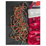 Holiday Decor Lot with Christmas Stockings, Ornaments, Garland, and Santa Sign