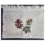 Bathroom Decor Set with Leaf Motif Towels, Red Ceramic Accessories, and Shower Hooks