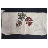 Bathroom Decor Set with Leaf Motif Towels, Red Ceramic Accessories, and Shower Hooks