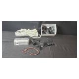Assorted Electronics and Accessories Including Brookstone Alarm Clock, Power Supplies, Cables, and Power Strip