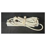 Assorted Electronics and Accessories Including Brookstone Alarm Clock, Power Supplies, Cables, and Power Strip