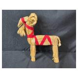 Holiday Decor Collection with Carved Trees, Straw Goat, and Merry Christmas Santa Figure