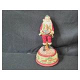 Holiday Decor Collection with Carved Trees, Straw Goat, and Merry Christmas Santa Figure