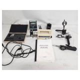 Comprehensive lot featuring a Zeiss Surfcom 130A surface roughness measuring instrument and a selection of digital and analog gauges, probes, and precision measuring accessories.