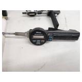 Comprehensive lot featuring a Zeiss Surfcom 130A surface roughness measuring instrument and a selection of digital and analog gauges, probes, and precision measuring accessories.
