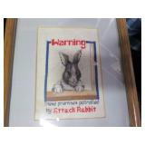 Larger rabbit themed statues with a...