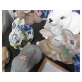 Larger rabbit themed statues with a...