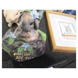 Larger rabbit themed statues with a...