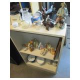 Shelf tilled with nic nacks, collec...