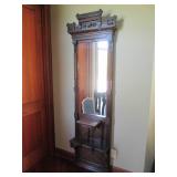 Ornately framed wall mirror with ma...
