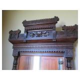 Ornately framed wall mirror with ma...