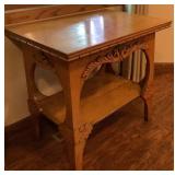 Antique Parlor Table with Carvings and Wooden Motif