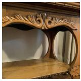 Antique Parlor Table with Carvings and Wooden Motif
