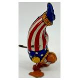Vintage J. Chein Clown Wind-Up Tin Toy, Plastic Hen with Eggs, and Red Metal Wagon Vintage J. Chein Clown Wind-Up Tin Toy, Plastic Hen with Eggs, and Red Metal Wagon