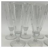 Set of 7 Etched Glass Champagne Flutes with Floral Design Set of 7 Etched Glass Champagne Flutes with Floral Design