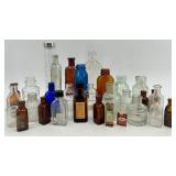 Collection of 25 Vintage Glass Bottles in Assorted Styles and Colors Collection of 25 Vintage Glass Bottles in Assorted Styles and Colors