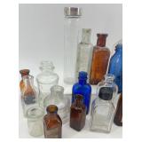 Collection of 25 Vintage Glass Bottles in Assorted Styles and Colors Collection of 25 Vintage Glass Bottles in Assorted Styles and Colors