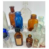 Collection of 25 Vintage Glass Bottles in Assorted Styles and Colors Collection of 25 Vintage Glass Bottles in Assorted Styles and Colors