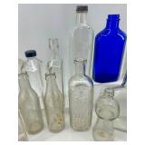 Collection of 18 Vintage and Antique Glass Bottles Assorted Colors and Shapes Collection of 18 Vintage and Antique Glass Bottles Assorted Colors and Shapes