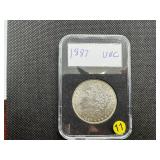 1887 Morgan Silver Dollar Marked UNC When Purchased 1887 Morgan Silver Dollar Marked UNC When Purchased