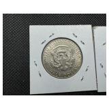 Two 90% Silver Kennedy Half Dollars - 1964 and 1964-D Both Marked AU 55 When Purchased Two 90% Silver Kennedy Half Dollars - 1964 and 1964-D Both Marked AU 55 When Purchased