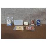 Collection of Vintage Cigarette Paper Packs and Metal Holders
