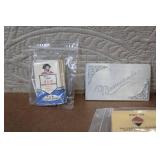 Collection of Vintage Cigarette Paper Packs and Metal Holders