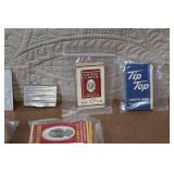 Collection of Vintage Cigarette Paper Packs and Metal Holders