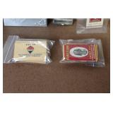 Collection of Vintage Cigarette Paper Packs and Metal Holders