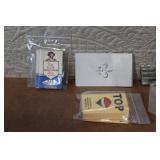 Collection of Vintage Cigarette Paper Packs and Metal Holders