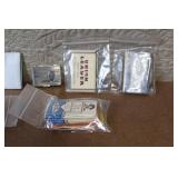 Collection of Vintage Cigarette Paper Packs and Metal Holders