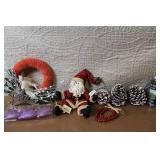 Collection of Christmas Decorations Including Hidden Talents Santa Doll, Wreath, Ornaments, and Pinecones
