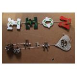 Collection of Christmas Decorations Including Hidden Talents Santa Doll, Wreath, Ornaments, and Pinecones