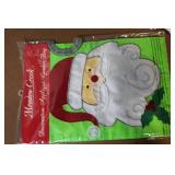 Collection of Christmas Decorations Including Hidden Talents Santa Doll, Wreath, Ornaments, and Pinecones