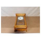 Wall Mount Pendulum Clock with Oak Finish and Roman Numeral Dial