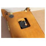 Wall Mount Pendulum Clock with Oak Finish and Roman Numeral Dial
