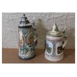 Pair of German Beer Steins with Pewter Lids and City Scenes