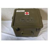 Military Surplus Collection with Ammo Cans, First Aid Kit, Boots, and Memorabilia