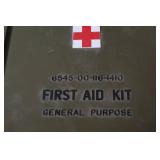 Military Surplus Collection with Ammo Cans, First Aid Kit, Boots, and Memorabilia