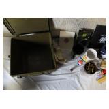 Military Surplus Collection with Ammo Cans, First Aid Kit, Boots, and Memorabilia