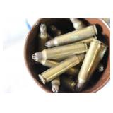 Military Surplus Collection with Ammo Cans, First Aid Kit, Boots, and Memorabilia