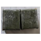 Military Surplus Collection with Ammo Cans, First Aid Kit, Boots, and Memorabilia