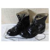 Military Surplus Collection with Ammo Cans, First Aid Kit, Boots, and Memorabilia
