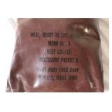 Military Surplus Collection with Ammo Cans, First Aid Kit, Boots, and Memorabilia