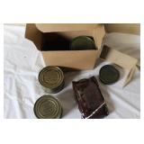 Military Surplus Collection with Ammo Cans, First Aid Kit, Boots, and Memorabilia