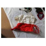 Military Surplus Collection with Ammo Cans, First Aid Kit, Boots, and Memorabilia