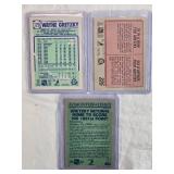 Lot of 3 Wayne Gretzky Hockey Cards including O-Pee-Chee and Topps sets with highlights and milestone stats